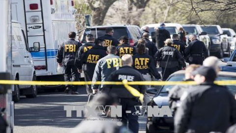 Lực lượng chức năng điều tra tại hiện trường vụ nổ ở Austin. Ảnh: TNS/TTXVN