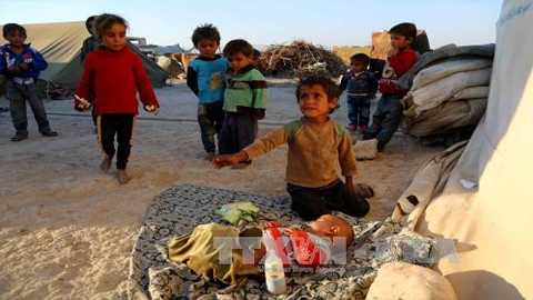 Trẻ em Syria tại trại tị nạn Ash'ari , khu vực Đông Ghouta. Ảnh: AFP/TTXVN