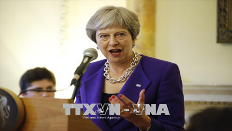 Thủ tướng Anh Theresa May phát biểu tại một sự kiện ở London ngày 4/7. Ảnh: AFP/TTXVN