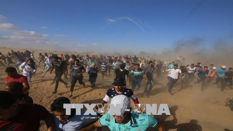 Xung đột giữa người biểu tình Palestine và quân đội Israel ở khu vực biên giới Dải Gaza - Israel ngày 20/7. Ảnh: THX/TTXVN