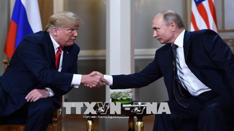 Tổng thống Nga Vladimir Putin (phải) và Tổng thống Mỹ Donald Trump trong cuộc gặp thượng đỉnh tại Helsinki, Phần Lan hồi tháng 7. Ảnh: AFP/TTXVN
