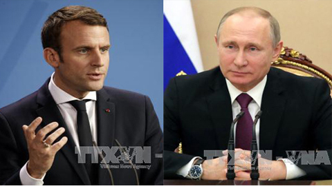 Tổng thống Emmanuel Macron và Tổng thống Nga Vladimir Putin (phải). Ảnh: EPA/TTXVN