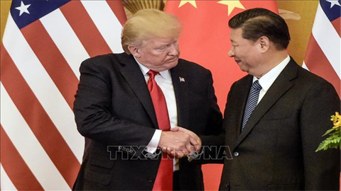 Tổng thống Mỹ Donald Trump (trái) và Chủ tịch Trung Quốc Tập Cận Bình trong cuộc gặp tại Bắc Kinh ngày 9/11/2017. Ảnh: AFP/TTXVN