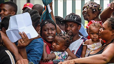Người di cư trong hành trình tới Mỹ tại khu vực Tapachula, bang Chiapas, Mexico, gần biên giới với Guatemala, ngày 27/6/2019. Ảnh: AFP/ TTXVN