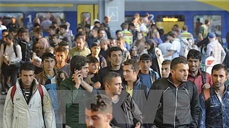 Người di cư tại nhà ga ở Munich ngày 12-9. Ảnh: AFP/TTXVN