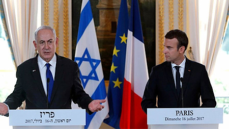 Tổng thống Emmanuel Macron và Thủ tướng Benjamin Netanyahu. (Ảnh: Reuters)