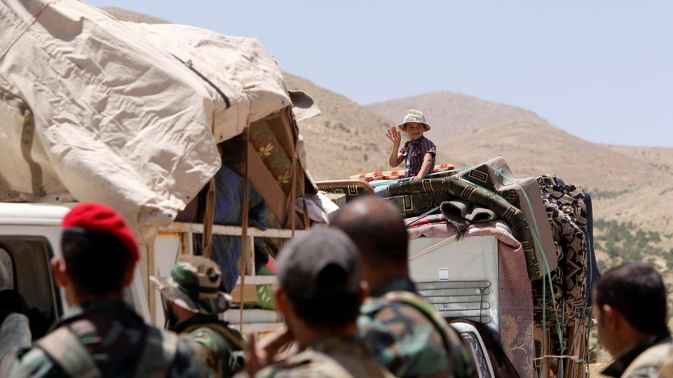 Em bé Syria hồi hương sau khi rời khỏi Lebanon, tháng 6-2018. (Ảnh: Reuters)